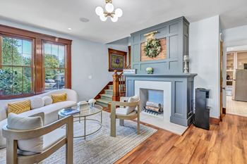 A living room with a fireplace and a couch.